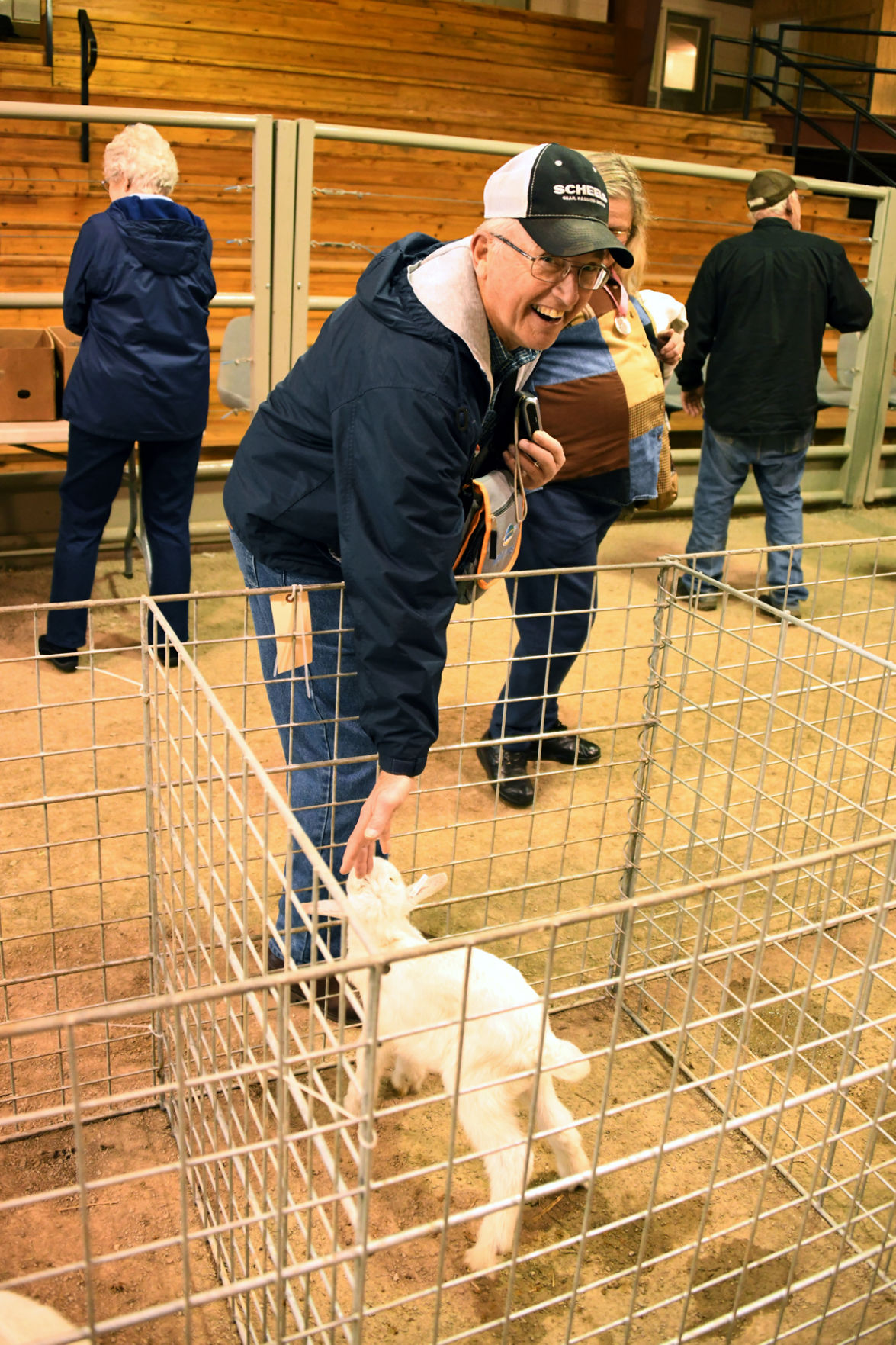 090 The baby goat sucks on Dale Epp's fingers!.JPG